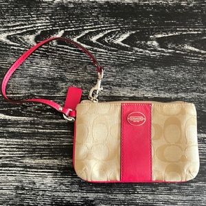 Coach wristlet NWOT. Clean exterior and interior with no defects.